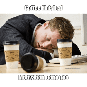 man sleeping on desk having couple of empty coffee cups in front of him