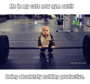 baby holding gym weight bar