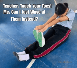 girl sitting in basket ball court and trying to touch toes